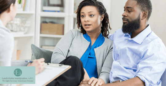 couple talking to someone taking notes