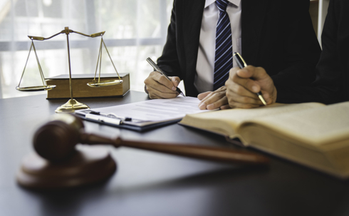 client and lawyer in law office