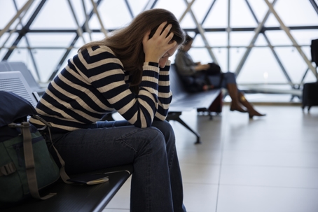 worried woman at the airport