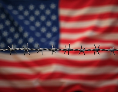 Barbed wire on the background of the USA flag for Illegal immigration concept